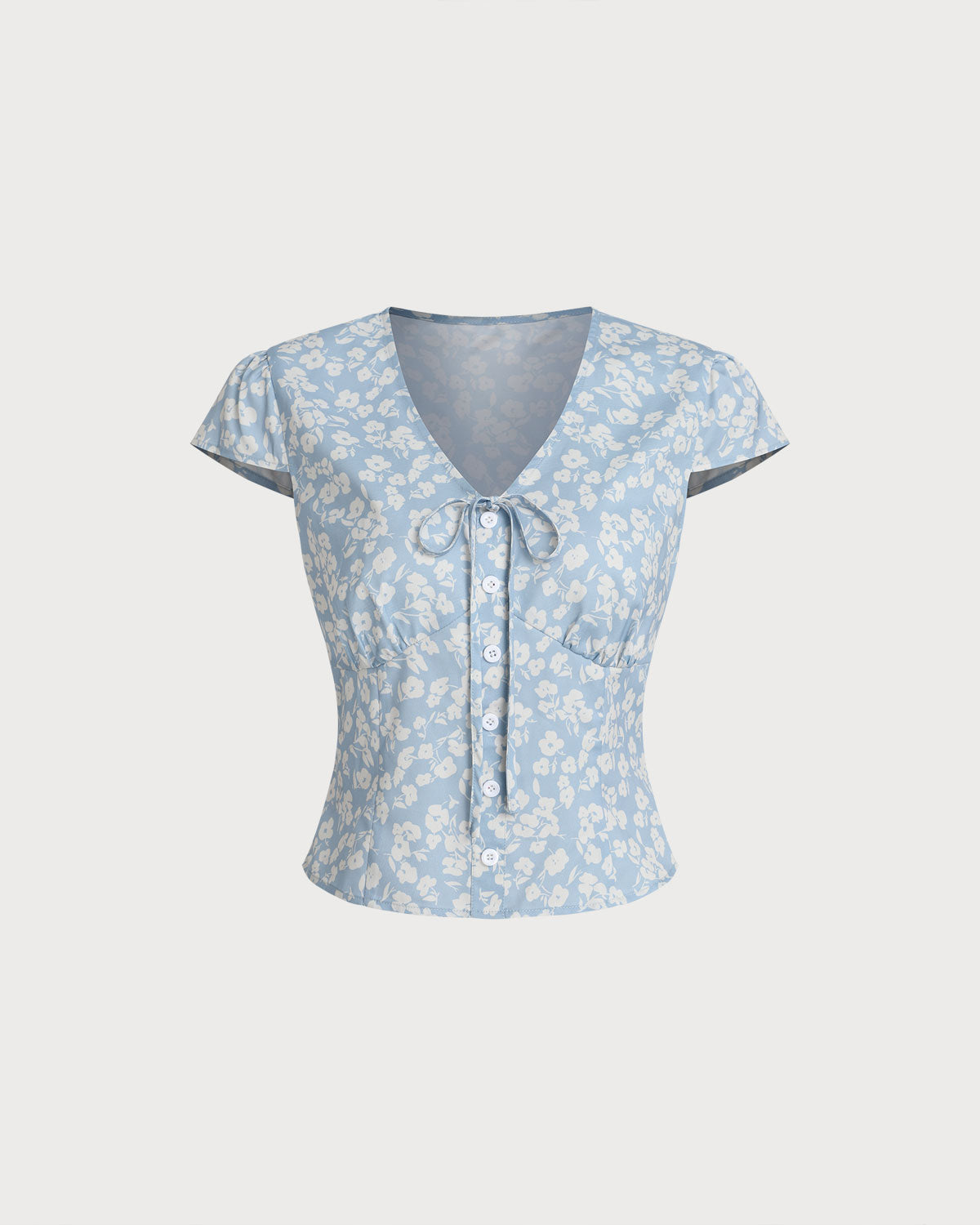 Blusa floral azul com decote em V
