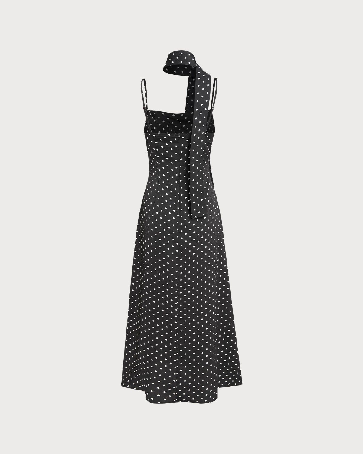 Vestido slip longo preto com estampa de poás e decote drapeado