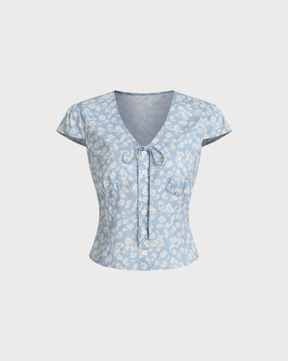 Blusa floral azul com decote em V