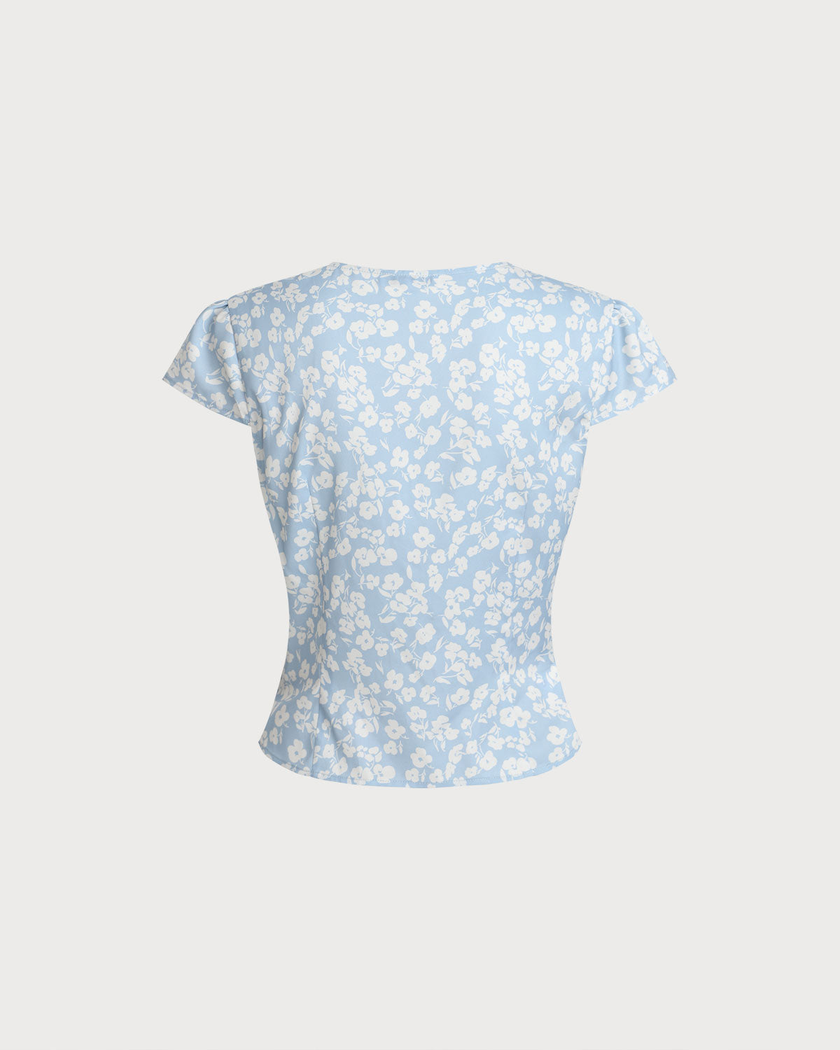 Blusa floral azul com decote em V