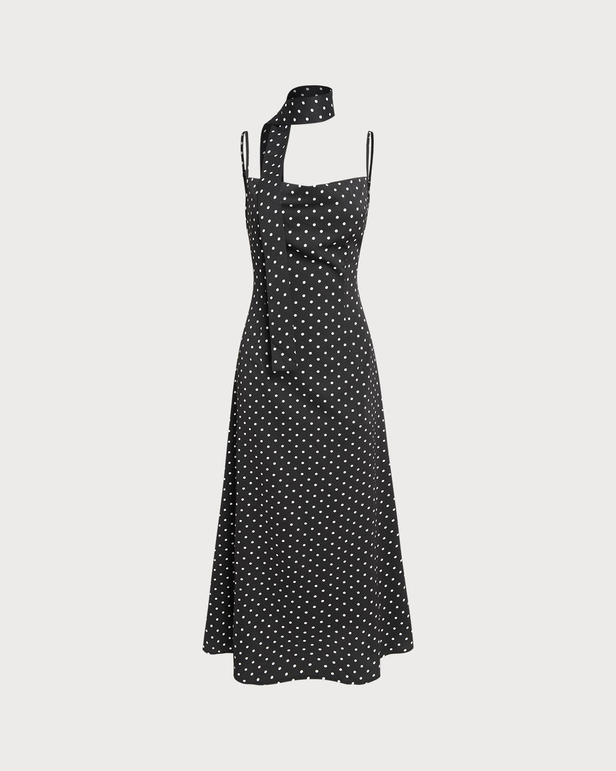 Vestido slip longo preto com estampa de poás e decote drapeado