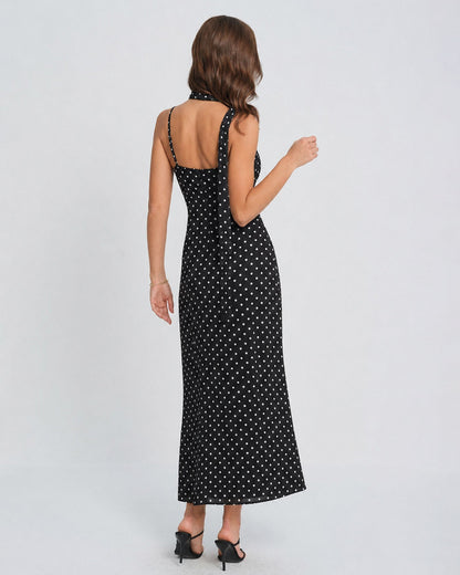 Vestido slip longo preto com estampa de poás e decote drapeado