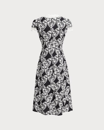 Vestido midi preto com estampa floral e detalhe em renda